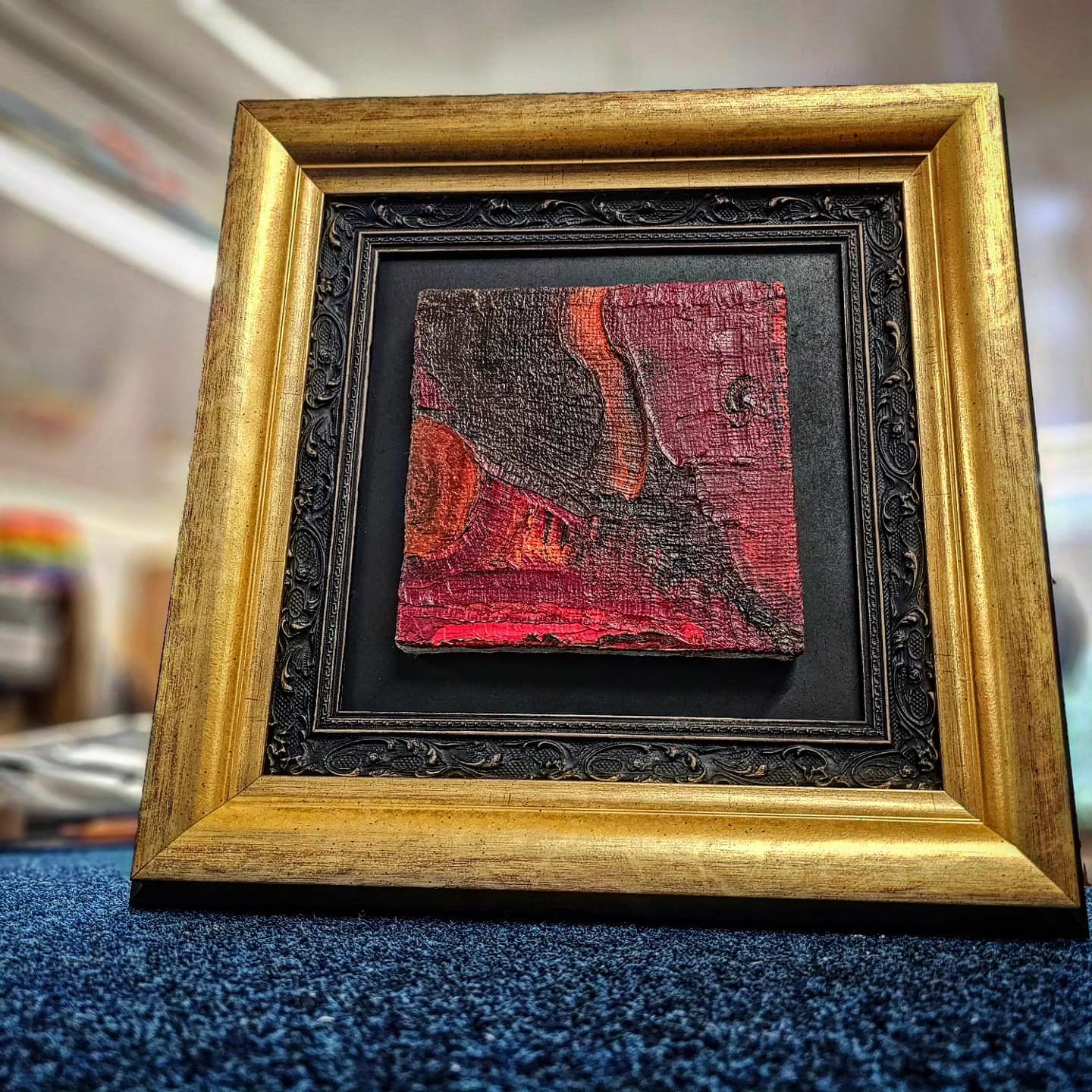 An original textured oil painting protected in a gilded frame at the Love to Frame workshop in Timperley, South Manchester